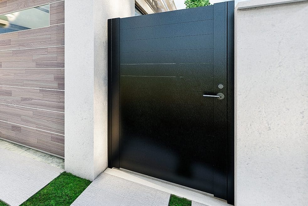 Aluminum pedestrian gate matched with a contemporary privacy fence
