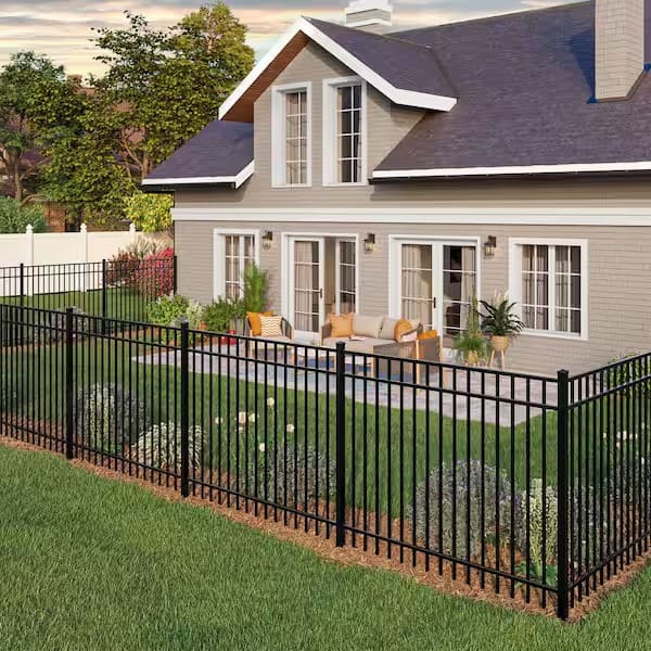 Flat-top black metal fence beside a contemporary home
