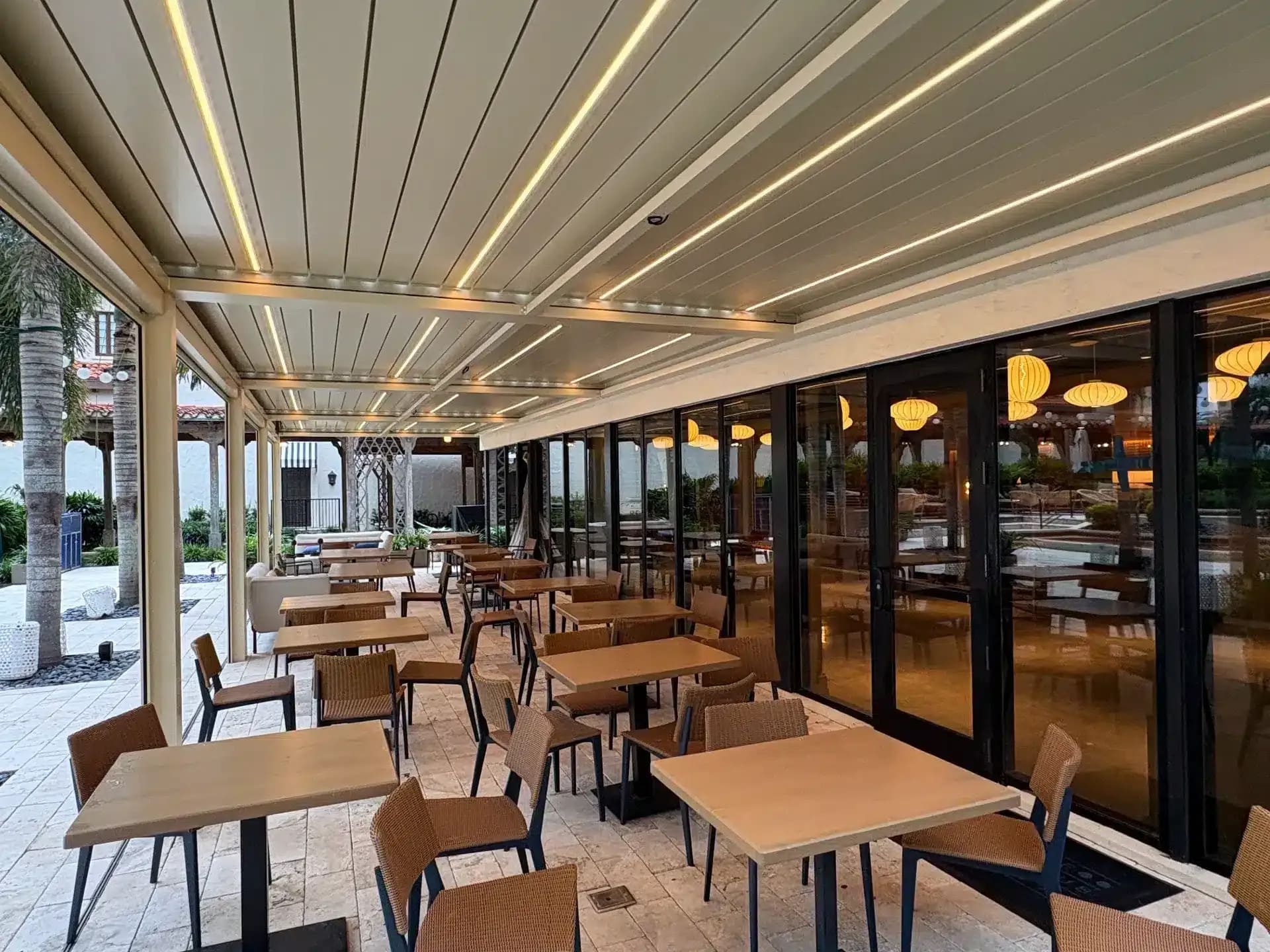 Wall mounted pergola application at a restaurant outdoor dining area